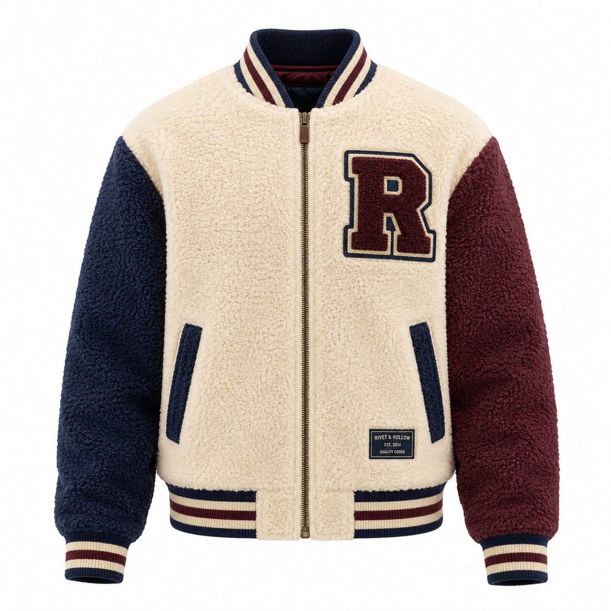 Cream sherpa varsity jacket with navy and maroon sleeves and letter patch