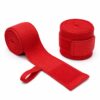 Pair of red boxing hand wraps, one rolled and one unrolled showing elastic weave