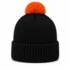 Black knit beanie with orange pom pom and folded ribbed cuff